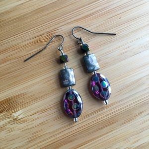 Iridescent purple dichroic glass drop earrings with peacock spot pattern